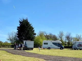 Motorhomes on green yards